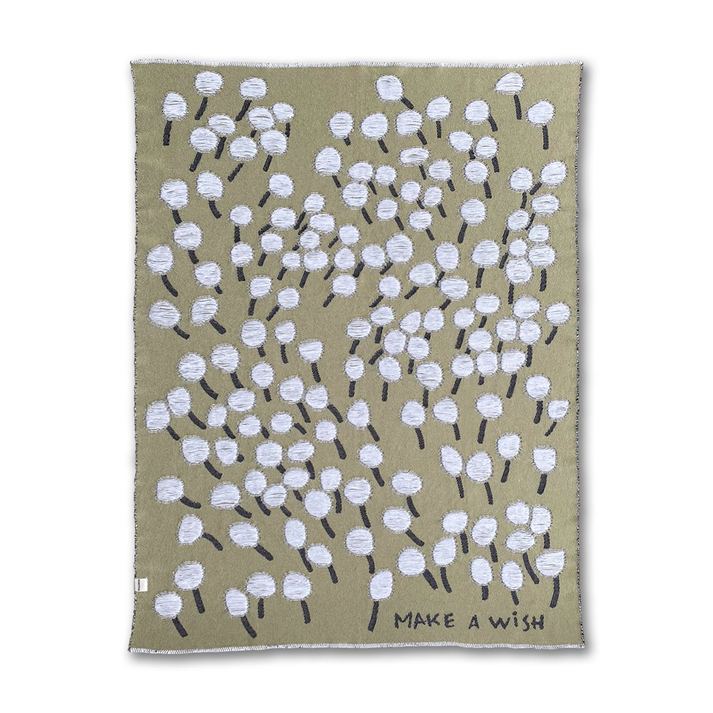 A cotton blanket with a dandelion design and the text 'Make a Wish' on a olive green background designed by Liucija Kostiva