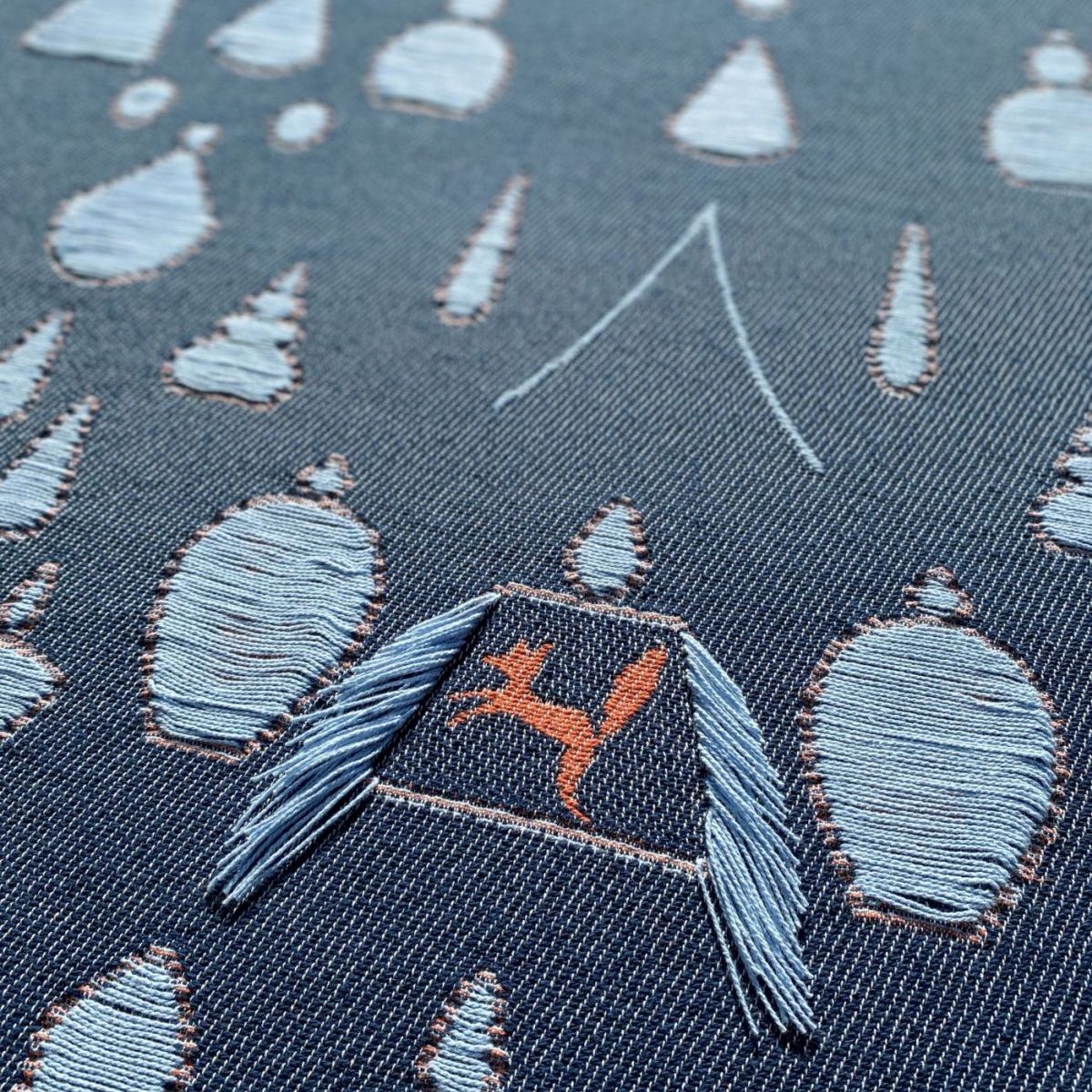 Cotton blanket close-up showing garden and animals pattern, designed by Liucija Kostiva