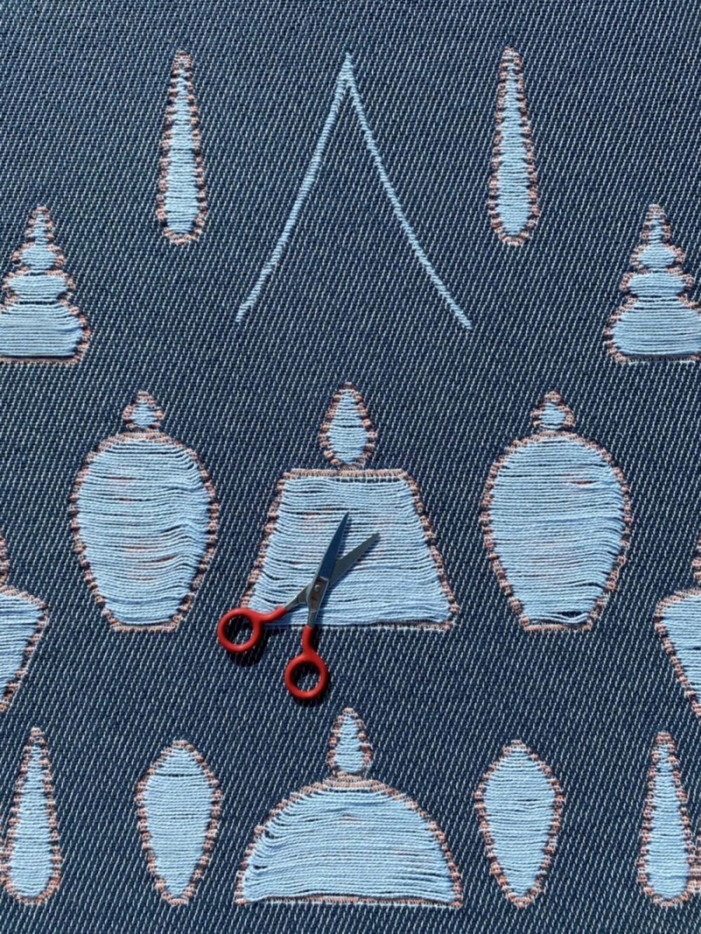 Cotton blanket close-up showing abstract topiary garden pattern, designed by Liucija Kostiva