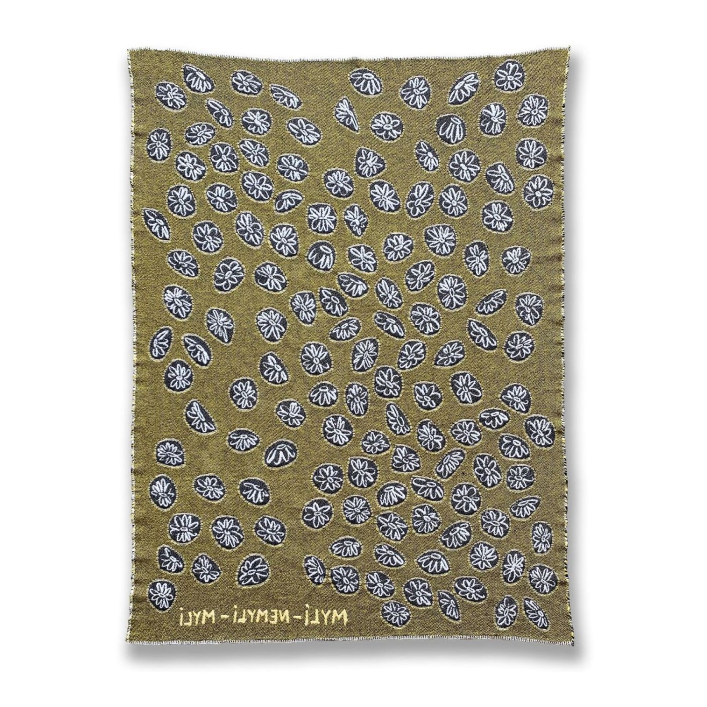 Back view of yellow and white cotton blanket with daisy pattern designed by Liucija Kostiva