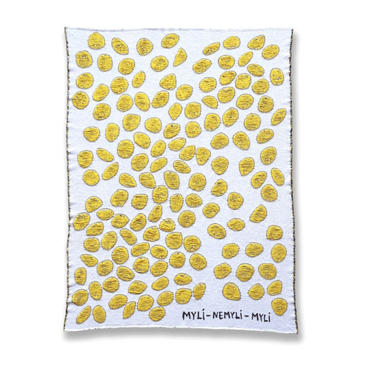 Front view of cotton blanket with white background and yellow circular pattern designed by Liucija Kostiva