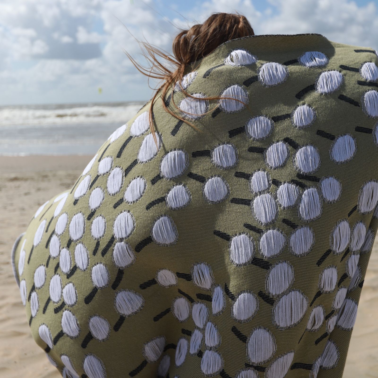 Detail of blanket with 'Make a Wish' design featuring a dandelion pattern designed by Liucija Kostiva