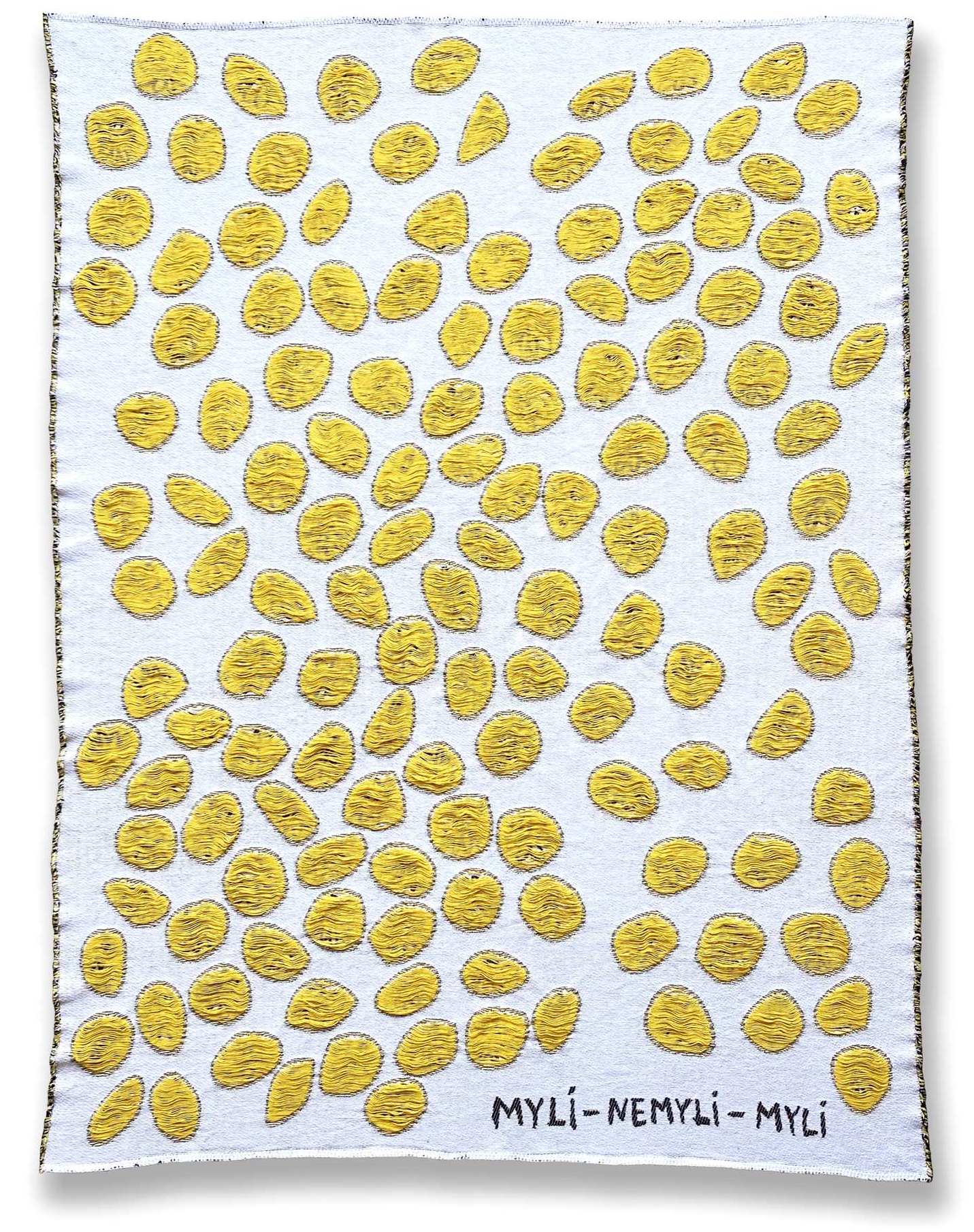 White blanket with yellow circular patterns 